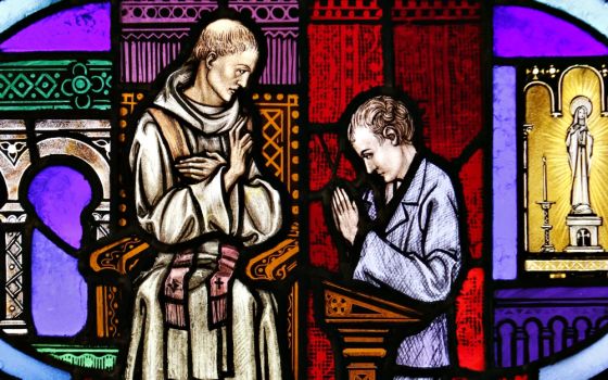 The sacrament of reconciliation is depicted in a stained-glass window at St. Aloysius Church in Great Neck, New York. (CNS/Gregory A. Shemitz)