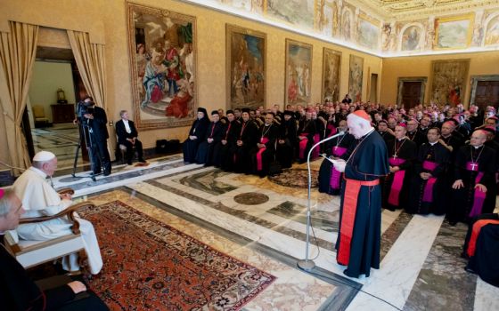 Pope Francis listens as Cardinal Marc Ouellet, prefect of the Congregation for Bishops, speaks during a meeting with recently appointed bishops from around the world at the Vatican Sept. 13. (CNS/Vatican Media)
