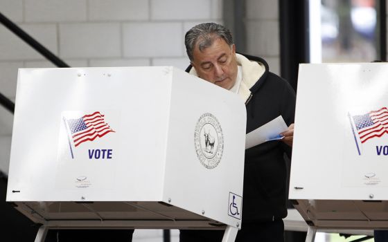 A man reviews his ballot at a polling station in Nesconset, New York, on Election Day Nov. 6, 2018. (CNS/Gregory A. Shemitz)
