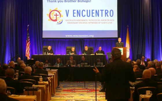 San Antonio Archbishop Gustavo García-Siller, at podium, listens to a question as he gives a report on V Encuentro at the 2018 fall general assembly of the U.S. Conference of Catholic Bishops in Baltimore. (CNS/Bob Roller)