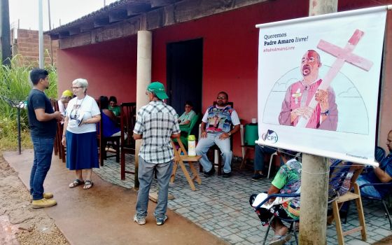 Supporters of Fr. José Amaro wait near the courthouse March 13 in Anapu in the Brazilian state of Pará for proceedings against him to finish. (Carlos Tautz)