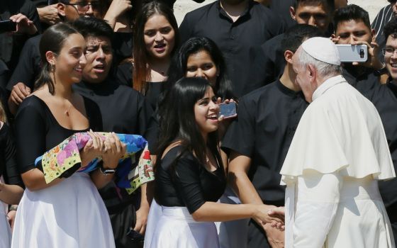 Pope Francis greets women during his general audience in St. Peter's Square at the Vatican June 26. (CNS/Paul Haring) 