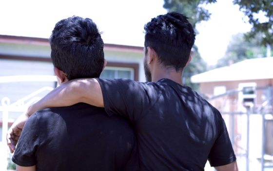 "Carlos" and "Enrique" pose for a photo June 12 in Riverside, Calif. The father and son left Guatemala in 2018 because of police corruption and were separated for more than two months upon arrival to the United States. (CNS/Angelus News/Pilar Marrero)