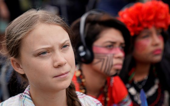 Swedish climate activist Greta Thunberg, then 16, listens to speakers during a climate change demonstration outside the U.S. Supreme Court Sept. 18, 2019, in Washington. (CNS/Kevin Lamarque, Reuters)