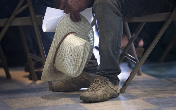 A farmworker attends Mass at the Centro Sin Fronteras in El Paso, Texas, Sept. 25, 2019, during a pastoral encounter by U.S. bishops with migrants at the border. (CNS/Tyler Orsburn)