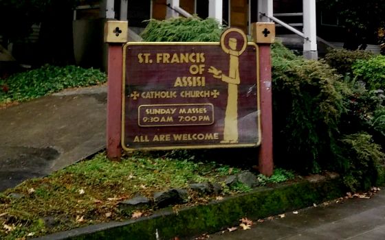 A sign welcomes all to St. Francis of Assisi Church in Portland, Oregon. (Peter Feuerherd)
