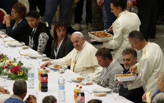 Pope Francis eats lunch with the poor in the Paul VI hall as he marks World Day of the Poor Nov. 17, 2019, at the Vatican. (CNS/Paul Haring)