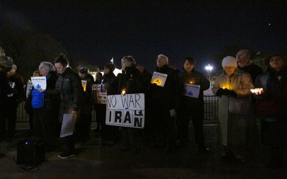 People gather Jan. 6 near the White House in Washington during a candlelight vigil to call for peaceful solutions to rising tensions between the United States and Iran. (CNS/Tyler Orsburn)