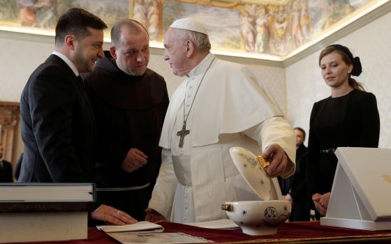 Pope Francis exchanges gifts with Ukrainian President Volodymyr Zelensky during a private audience at the Vatican Feb. 8, 2020. (CNS/Gregorio Borgia, pool via Reuters)