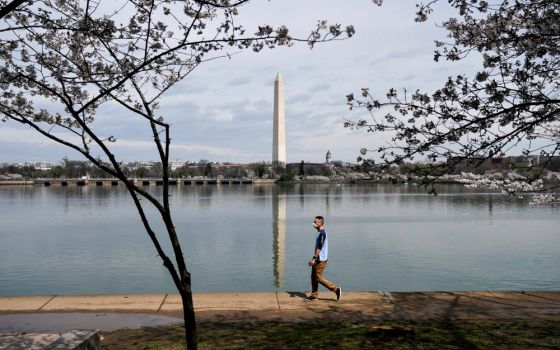 A man in Washington wears a face mask during the outbreak of coronavirus March 19. (CNS/Reuters/Joshua Roberts)