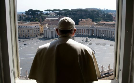 Pope Francis looks over an empty St. Peter's Square after leading a livestream of the recitation of the Angelus from the library of the Apostolic Palace March 22. (CNS/Vatican Media)