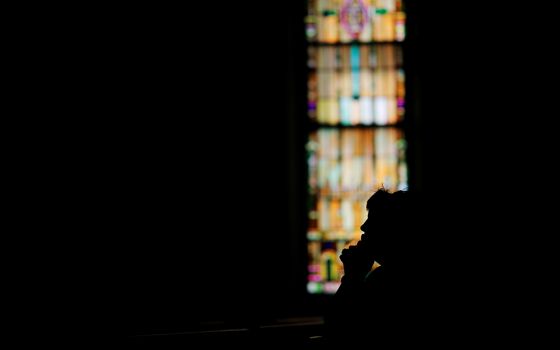 A woman prays in St. John the Baptist Catholic Church in Quincy, Massachusetts, in 2017. (CNS/Reuters/Brian Snyder)