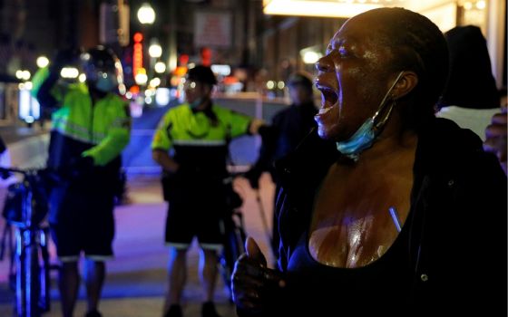 A protester in Boston screams after being affected by a chemical agent used by metro police May 31. (CNS/Reuters/Brian Snyder)