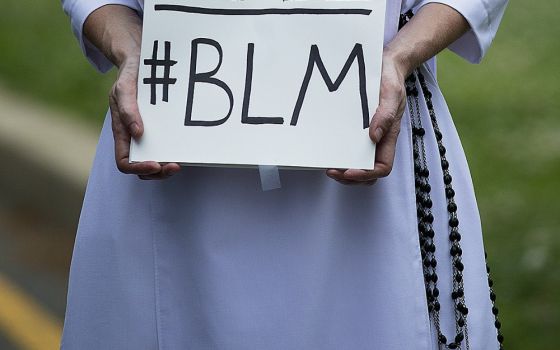A Dominican sister protests racial injustice June 2 in Washington, D.C. (CNS/Tyler Orsburn)