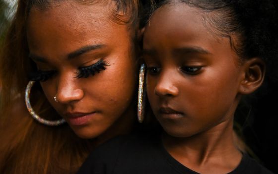 People are seen in Houston June 19. The date, known as Juneteenth, honors the end to slavery in the United States and is considered the longest-running African American holiday. (CNS/Reuters/Callaghan O'Hare)