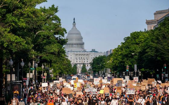 Demonstrators protesting racial injustice in Washington march down Constitution Avenue June 13, 2020. In a webinar, Rudy Dehaney, coordinator of youth and young adult ministry for the Northeast Catholic Community in Baltimore, said young adult ministers n