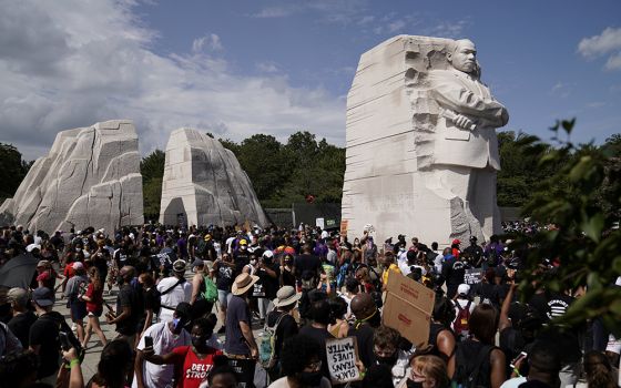 Demonstrators gather next to the Martin Luther King Jr. Memorial for the Aug. 28, 2020, "Get Your Knee Off Our Necks" March on Washington 2020 in support of racial justice. (CNS/Reuters/Erin Scott)