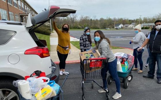 The way in which young people have bridged differences during the pandemic models path of dialogue and relationship for church, Cardinal Gregory says. Volunteers from St. Gabriel Parish in Baltimore help families during a food drive in October 2020. Pope 