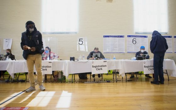 People check in to vote during the presidential election at Ida B. Wells Middle School in Washington Nov. 3. (CNS/Tyler Orsburn)