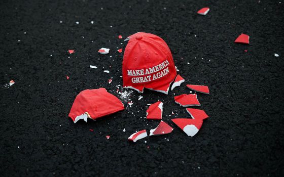 A ceramic "Make America Great Again" hat lies broken on the ground as people gather at Black Lives Matter Plaza in Washington Nov. 3. (CNS/Hannah McKay, Reuters)
