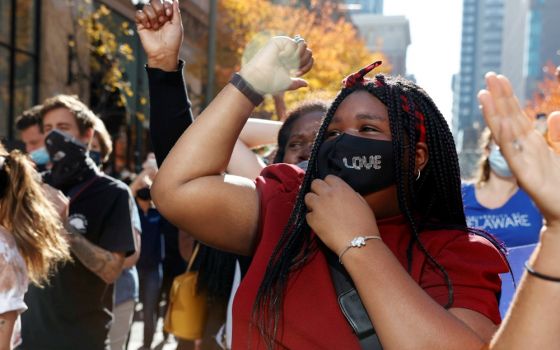 People react in Philadelphia Nov. 7 as media announces that Democratic U.S. presidential nominee Joe Biden is the projected winner of the 2020 presidential election. (CNS/Reuters/Rachel Wisniewski)