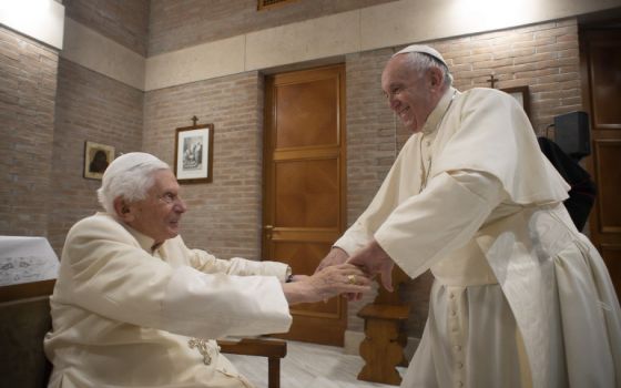 Pope Francis, right, greets retired Pope Benedict XVI at the retired pope's residence during a visit with new cardinals after a consistory at the Vatican Nov. 28, 2020. (CNS/Vatican Media)