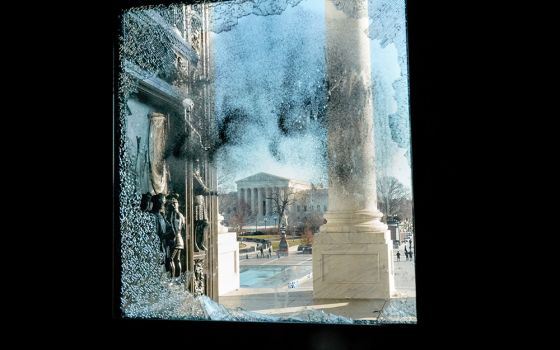 The U.S. Supreme Court is seen through a smashed glass door at the U.S. Capitol in Washington Jan. 7, one day after supporters of President Donald Trump stormed Capitol Hill. (CNS/Reuters/Erin Scott)