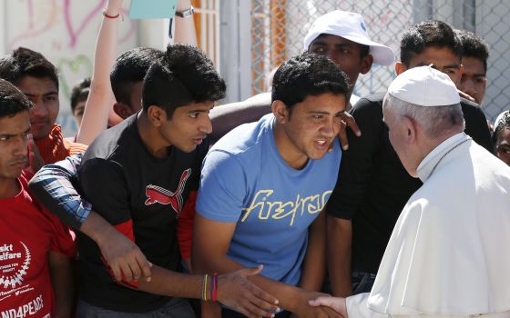 Pope Francis meets refugees at the Moria refugee camp on the island of Lesbos, Greece, in this April 16, 2016, file photo. (CNS photo/Paul Haring)