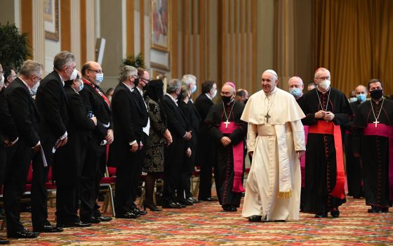 Pope Francis walks near diplomats accredited to the Holy See during an audience in the Hall of Blessings at the Vatican Feb. 8, 2021. (CNS/Vatican Media)