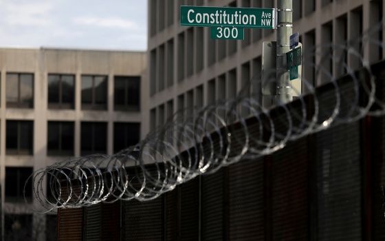 Fencing topped with razor wire surrounds buildings on Capitol Hill in Washington Feb. 9, the first day of the second impeachment trial of former President Donald Trump. (CNS/Leah Millis, Reuters)
