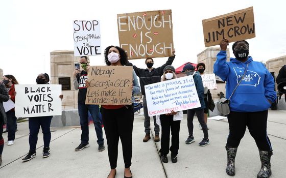 Demonstrators in Atlanta gather outside the Georgia State Capitol March 1 to protest H.B. 531, passed by the Georgia House to restrict ballot drop boxes, require more I.D. for absentee voting and limit weekend early voting days passed. (CNS/Reuters)