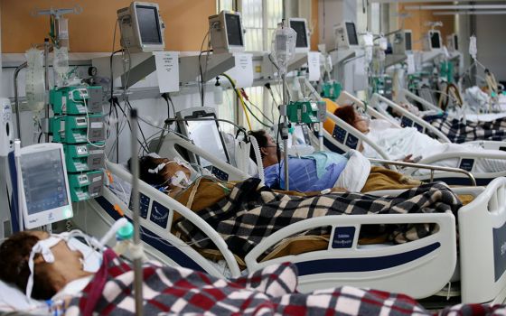Patients in the emergency room of the Nossa Senhora da Conceição hospital in Porto Alegre, Brazil March 11. The emergency room is overcrowded because of the spike in COVID-19 cases. (CNS/Reuters/Diego Vara)