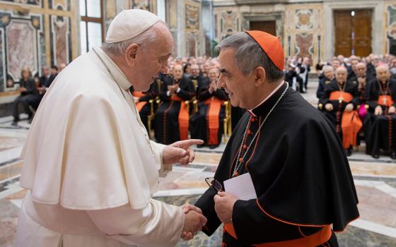 Pope Francis greets Cardinal Giovanni Angelo Becciu, then prefect of the Congregation for Saints' Causes, at the Vatican Dec. 16, 2019. (CNS/Vatican Media)