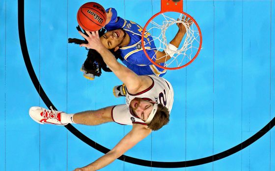 UCLA Bruins guard Tyger Campbell shoots the ball against Gonzaga Bulldogs forward Drew Timme during the second half in the national semifinals of the Final Four of the 2021 NCAA Tournament at Lucas Oil Stadium in Indianapolis April 3, 2021. (CNS)