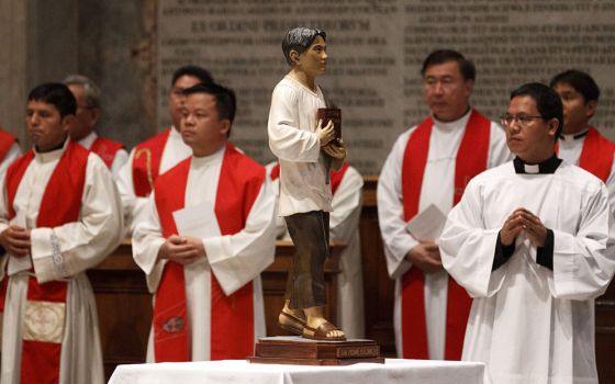 A statue of St. Pedro Calungsod, a lay catechist from the Philippines who was martyred in Guam in 1672, is seen during a Mass of thanksgiving for his canonization, in St. Peter's Basilica at the Vatican Oct. 22, 2012. (CNS/Paul Haring)