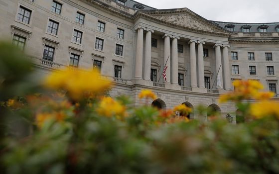 Flowers are seen in front of the headquarters of the Environmental Protection Agency May 10 in Washington. (CNS/Reuters/Andrew Kelly)