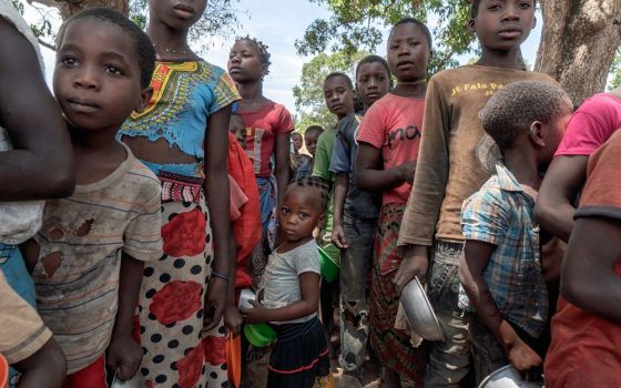 Displaced Mozambicans gather in a camp in the country's Cabo Delgado province in this 2019 photo. Residents in northern Mozambique have been grappling with an Islamist insurgency since 2017. (CNS/Courtesy of AVSI/Alessandro Grassani)