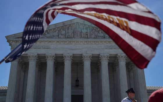 A U.S. flag flies in front of the Supreme Court June 25, 2018, in Washington. (CNS/Reuters/Toya Sarno Jordan)