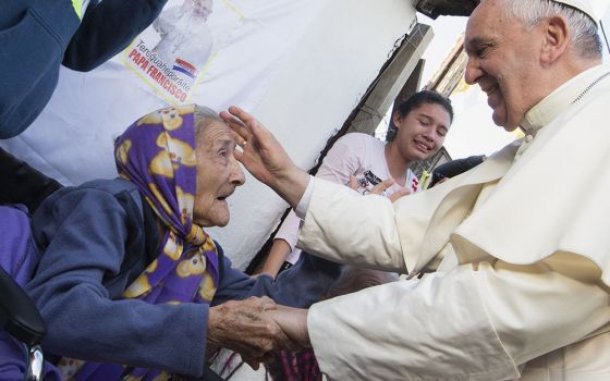 Pope Francis greets an elderly woman as he meets with people in Asunción, Paraguay, on July 12, 2015. (CNS/Paul Haring)