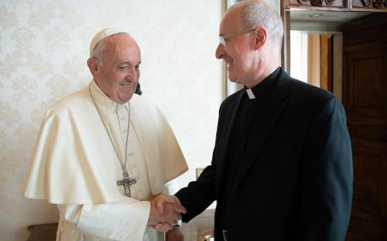 Pope Francis greets Jesuit Fr. James Martin, author and editor at large of America magazine, during a private meeting at the Vatican in this Oct. 1, 2019, file photo. Martin released a recent handwritten letter from the pope that commended his LGBT minist