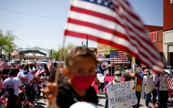 Members of the Border Network for Human Rights and the Reform Immigration Alliance for Texas hold a march in El Paso, Texas, April 10.