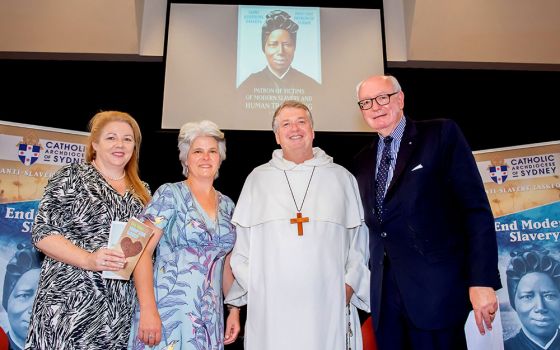Alison Rahill, left, Jenny Stanger and John Fisher of the Sydney Archdiocese's Anti-Slavery Task Force are joined by Archbishop Anthony Fisher at a seminar on ethical sourcing of products in 2020. (CNS)