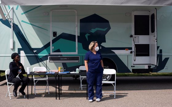 Nurses in Detroit wait for people to come by to receive their COVID-19 vaccine at a mobile pop-up vaccination clinic hosted by the Detroit Health Department with the Detroit Public Schools Community District July 21. (CNS/Reuters/Emily Elconin)