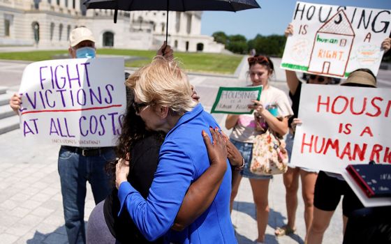U.S. Rep. Cori Bush and U.S. Sen. Elizabeth Warren embrace July 31, 2021, in front of the U.S. Capitol in Washington. Bush spent the night there to highlight the midnight expiration of a pandemic-related federal moratorium on residential evictions. (CNS)