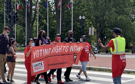 Men and women from different religious groups march toward the U.S. Capitol in Washington Aug. 2, 2021, during a protest for voting rights and economic justice organized by the Poor People's Campaign: A National Call for Moral Revival. (CNS photo/Melissa 