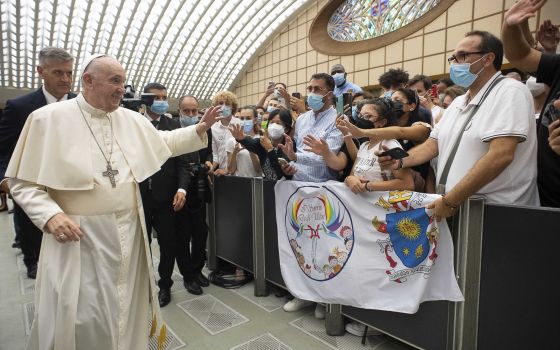 Pope Francis greets the crowd during his general audience in Paul VI hall at the Vatican Aug. 4, 2021. It was his first audience since undergoing colon surgery July 4. (CNS photo/Vatican Media)