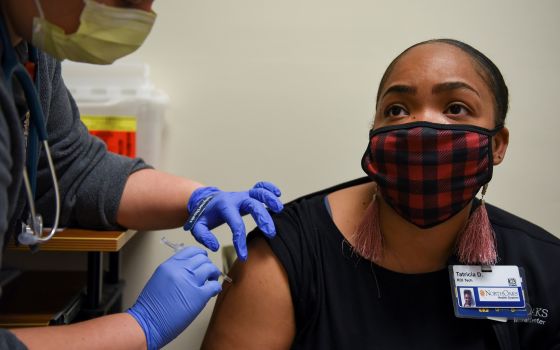 A woman receives a COVID-19 vaccine at North Oaks Medical Center in Hammond, La., Aug. 5, 2021. Results of a new poll released Aug. 5 showed many parents are hesitant about COVID-19 vaccines for their children. (CNS photo/Callaghan O'Hare, Reuters)