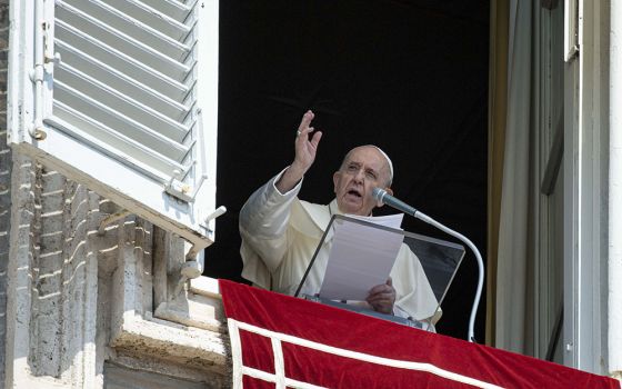 Pope Francis leads the Angelus from the window of his studio overlooking St. Peter's Square at the Vatican Aug. 22. (CNS/Vatican Media)
