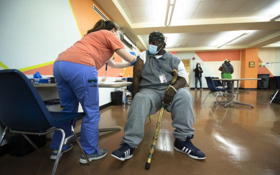A man at Catholic Charities in the Brookland neighborhood of Washington receives the Johnson & Johnson COVID-19 vaccine May 18 at a pop-up clinic. (CNS/Tyler Orsburn)