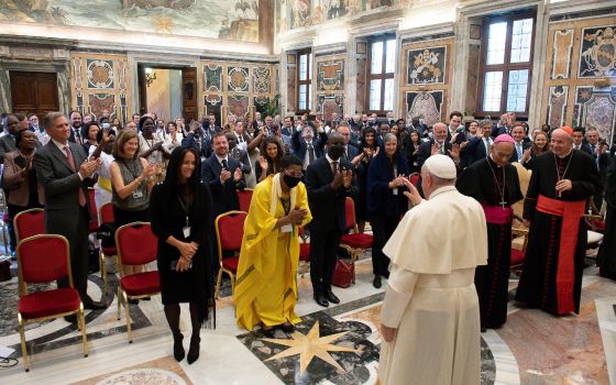 Pope Francis greets members of the International Catholic Legislators Network during an audience at the Vatican Aug. 27, 2021. The pope spoke to Catholic and Christian legislators about the need to regulate and develop sound policies regarding today's dig
